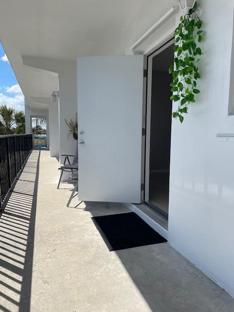 111 Southeast 1st Street, Unit 7 Boynton Beach, FL 33435 - Photo 21 of 24 Walkway 2nd floor