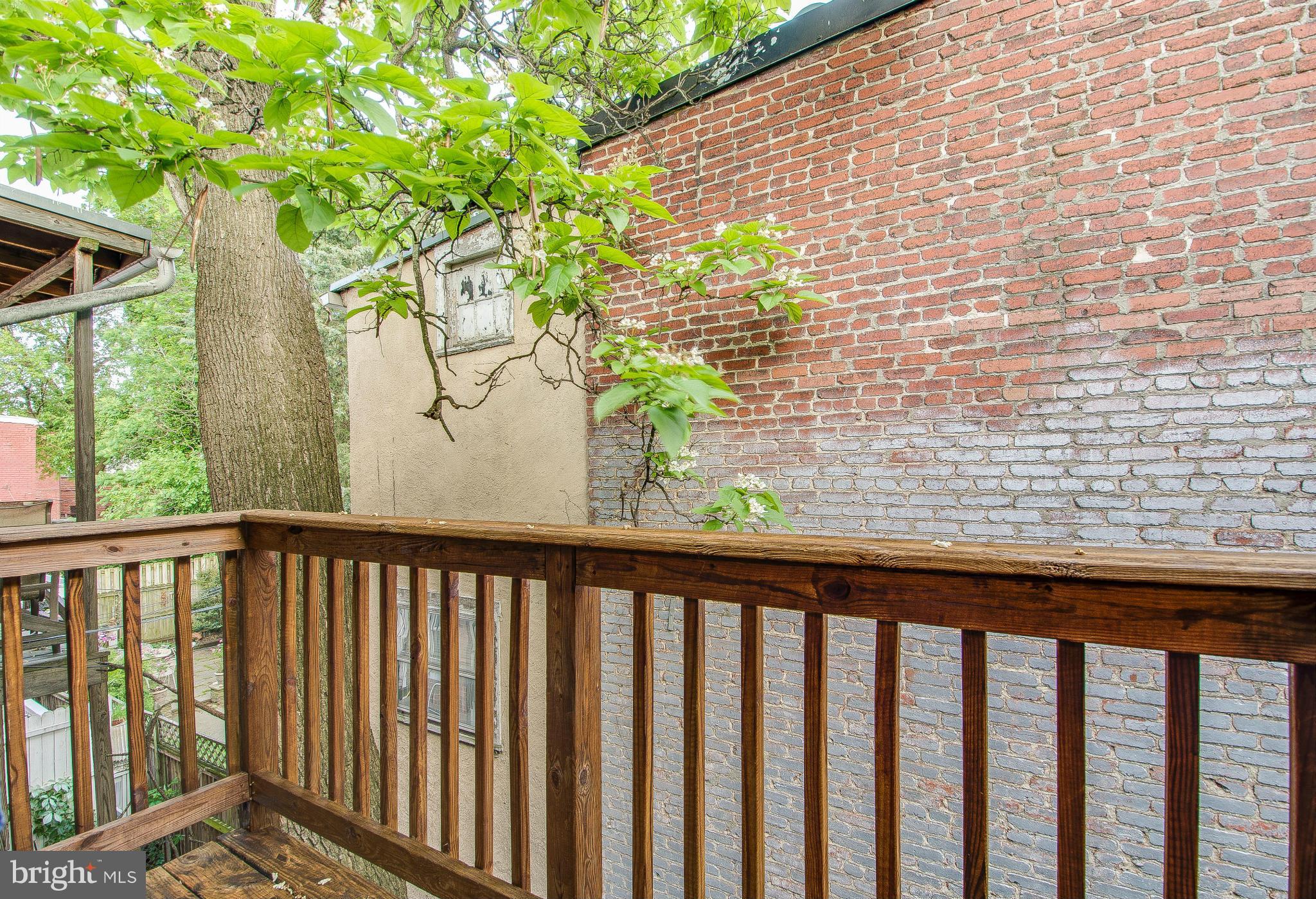 703 E Street Northeast Washington, DC 20002 - Photo 21 of 30 Balcony on upper level looks over beautiful deck.
