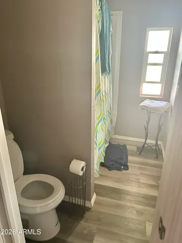a bathroom with a toilet and a sink
