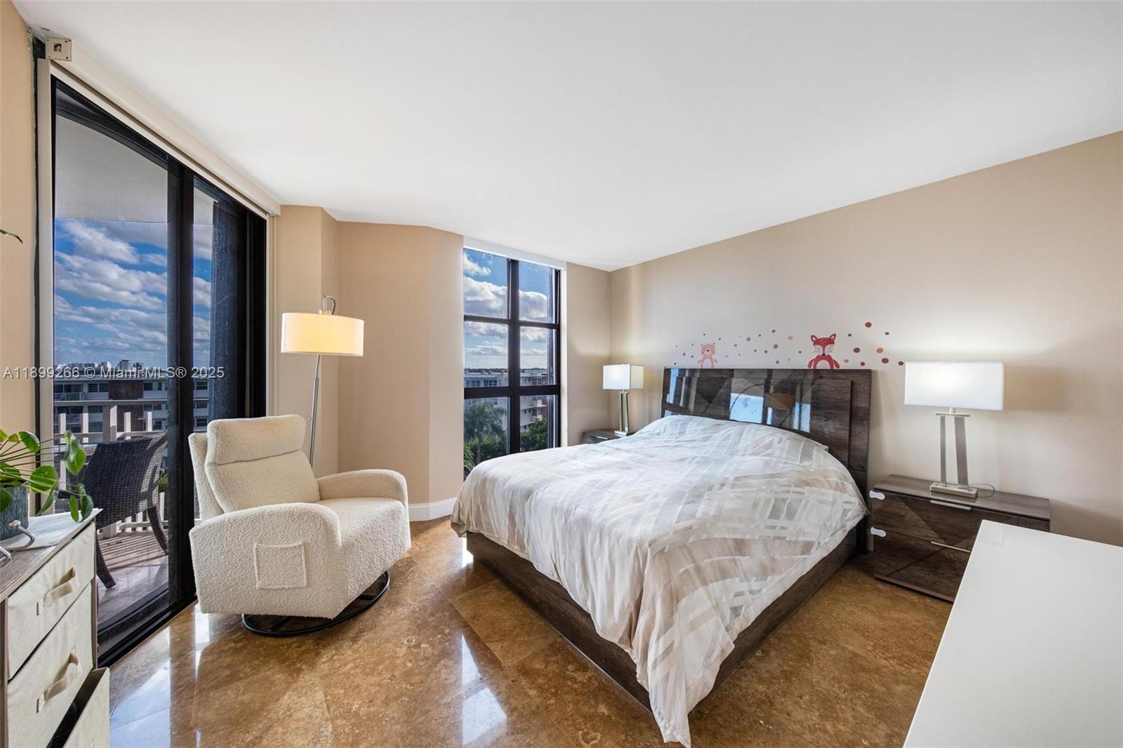 4000 Towerside Terrace, Unit 604 Miami, FL 33138 - Photo 15 of 79 a bedroom with a bed a couch and a large window