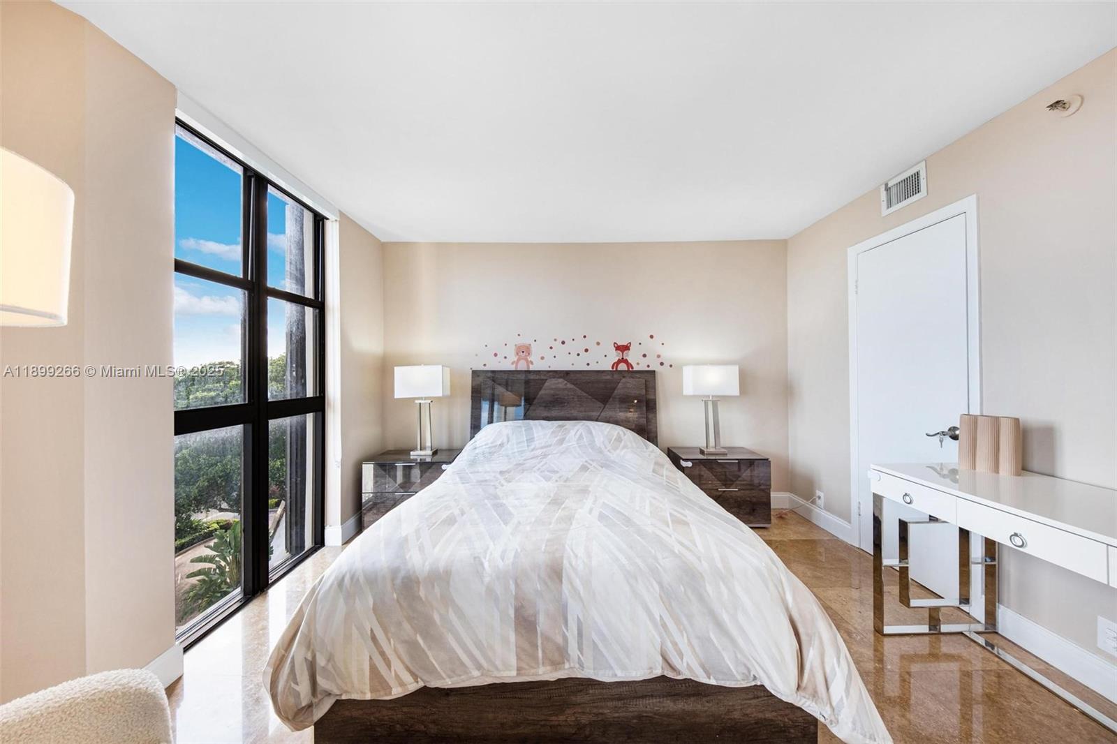 4000 Towerside Terrace, Unit 604 Miami, FL 33138 - Photo 16 of 79 a bedroom with a large bed and a large window