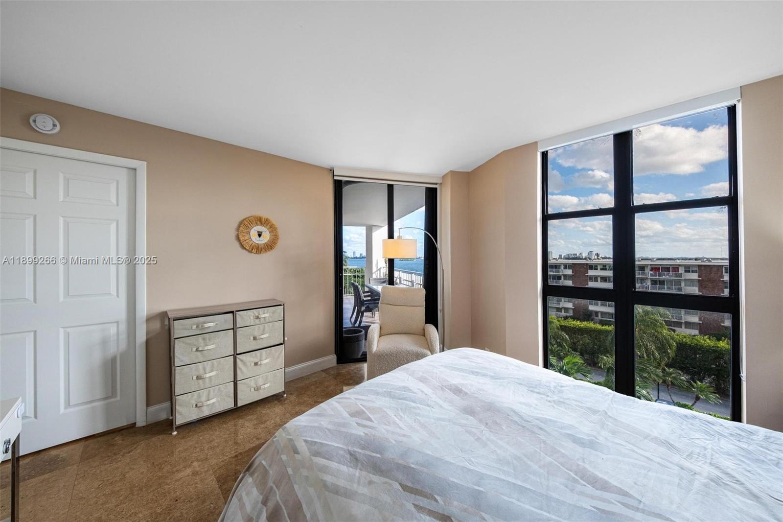 4000 Towerside Terrace, Unit 604 Miami, FL 33138 - Photo 17 of 79 a bedroom with a bed and a large window