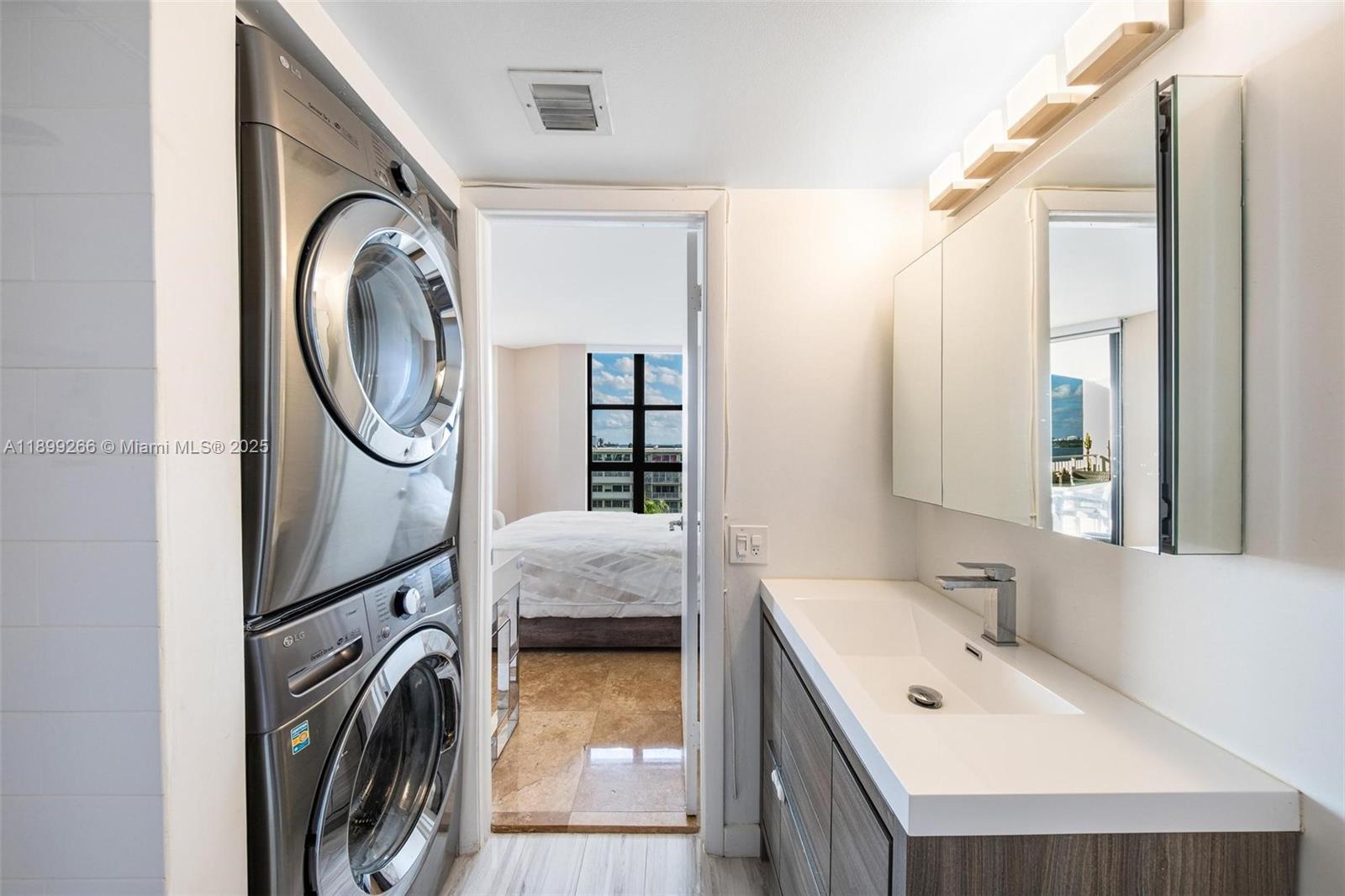 4000 Towerside Terrace, Unit 604 Miami, FL 33138 - Photo 19 of 79 a en suite bathroom with a sink and a mirror