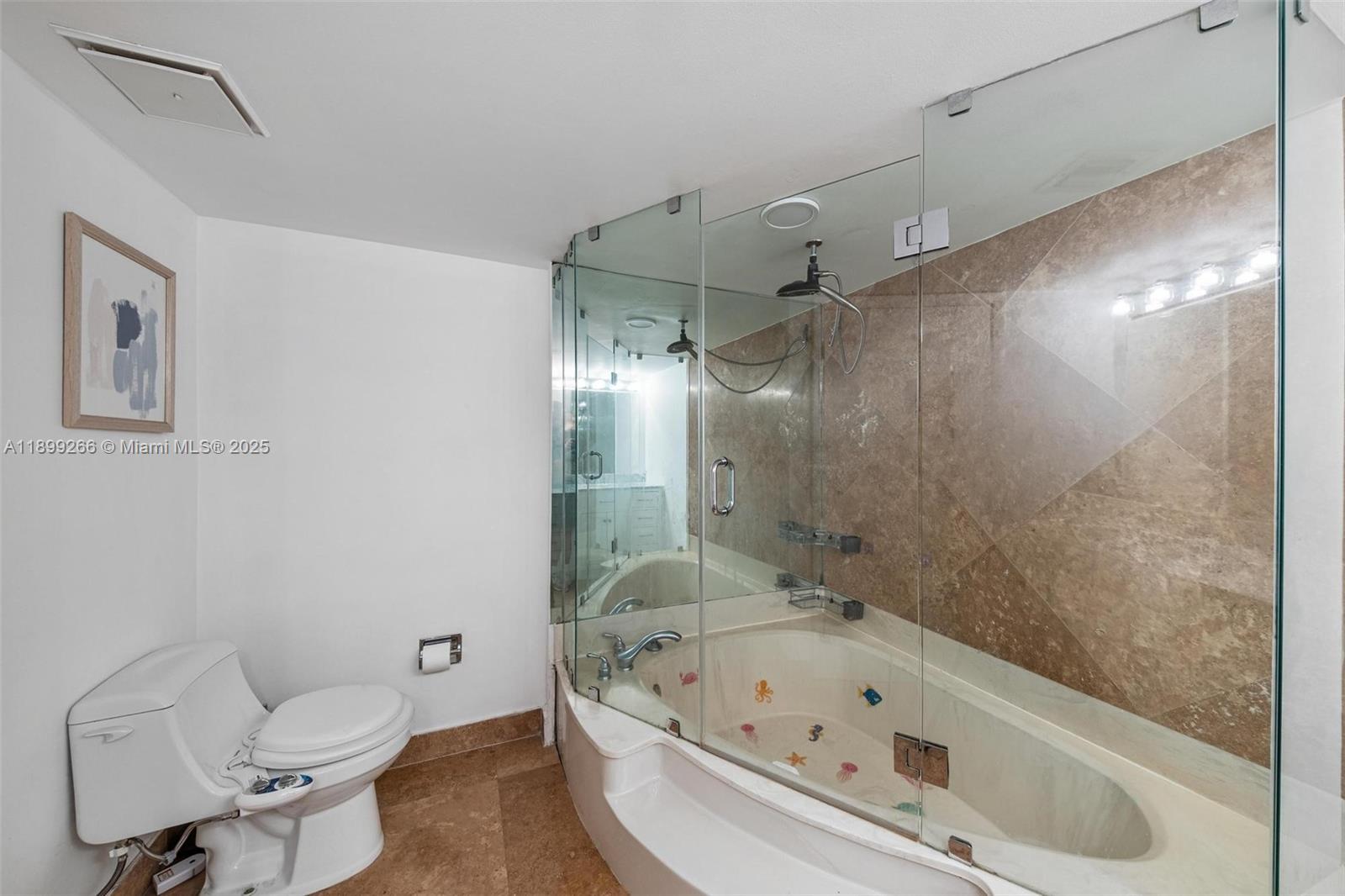 4000 Towerside Terrace, Unit 604 Miami, FL 33138 - Photo 25 of 79 a bathroom with a tub a toilet and a shower