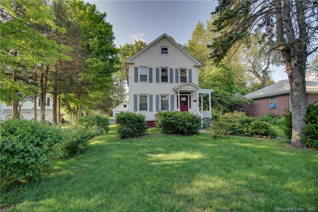 127 Spring Street Windsor Locks, CT 06096 - Photo 1 of 1 a front view of a house with a yard and trees