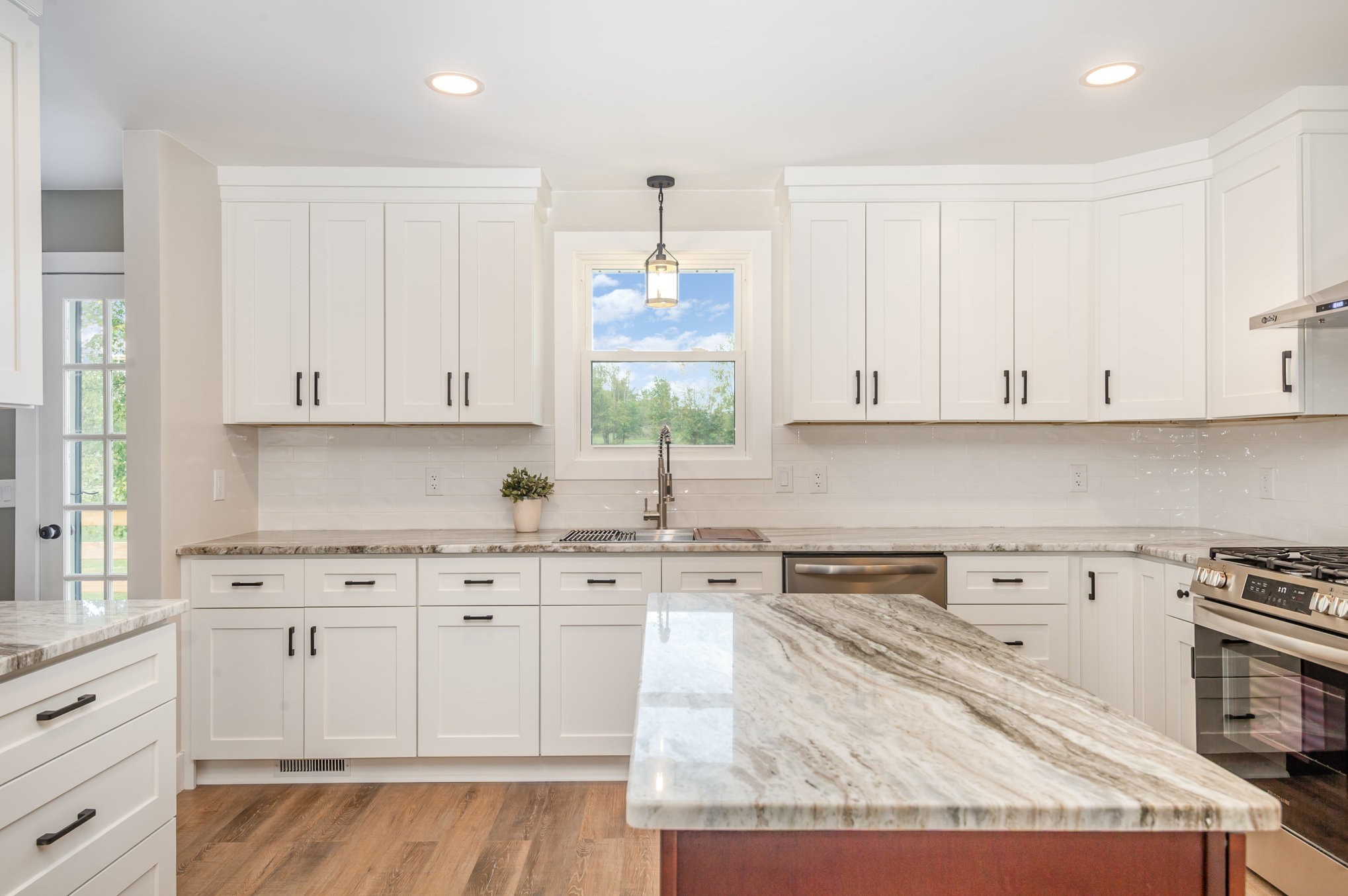 231 South Palmers Chapel Road White House, TN 37188 - Photo 11 of 40 a kitchen with stainless steel appliances granite countertop a sink a stove and cabinets