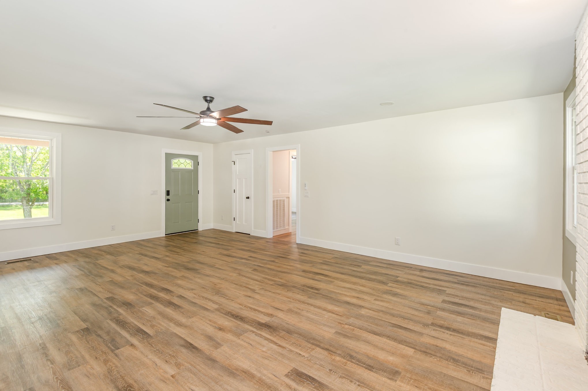 231 South Palmers Chapel Road White House, TN 37188 - Photo 8 of 40 wooden floor in an empty room with a window