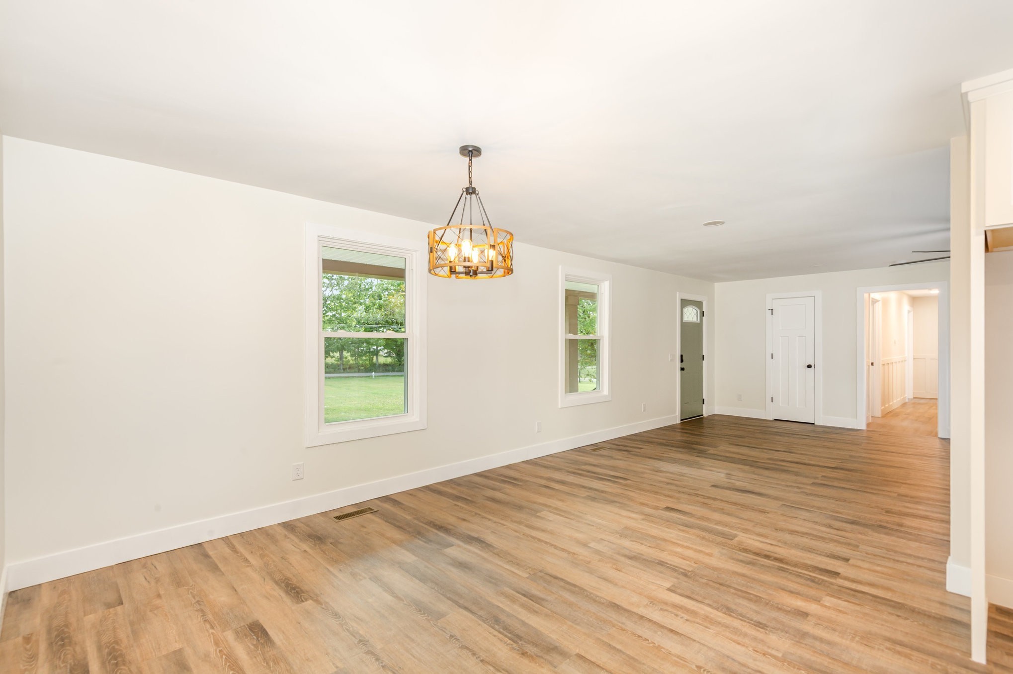 231 South Palmers Chapel Road White House, TN 37188 - Photo 9 of 40 a view of an empty room with wooden floor and a window