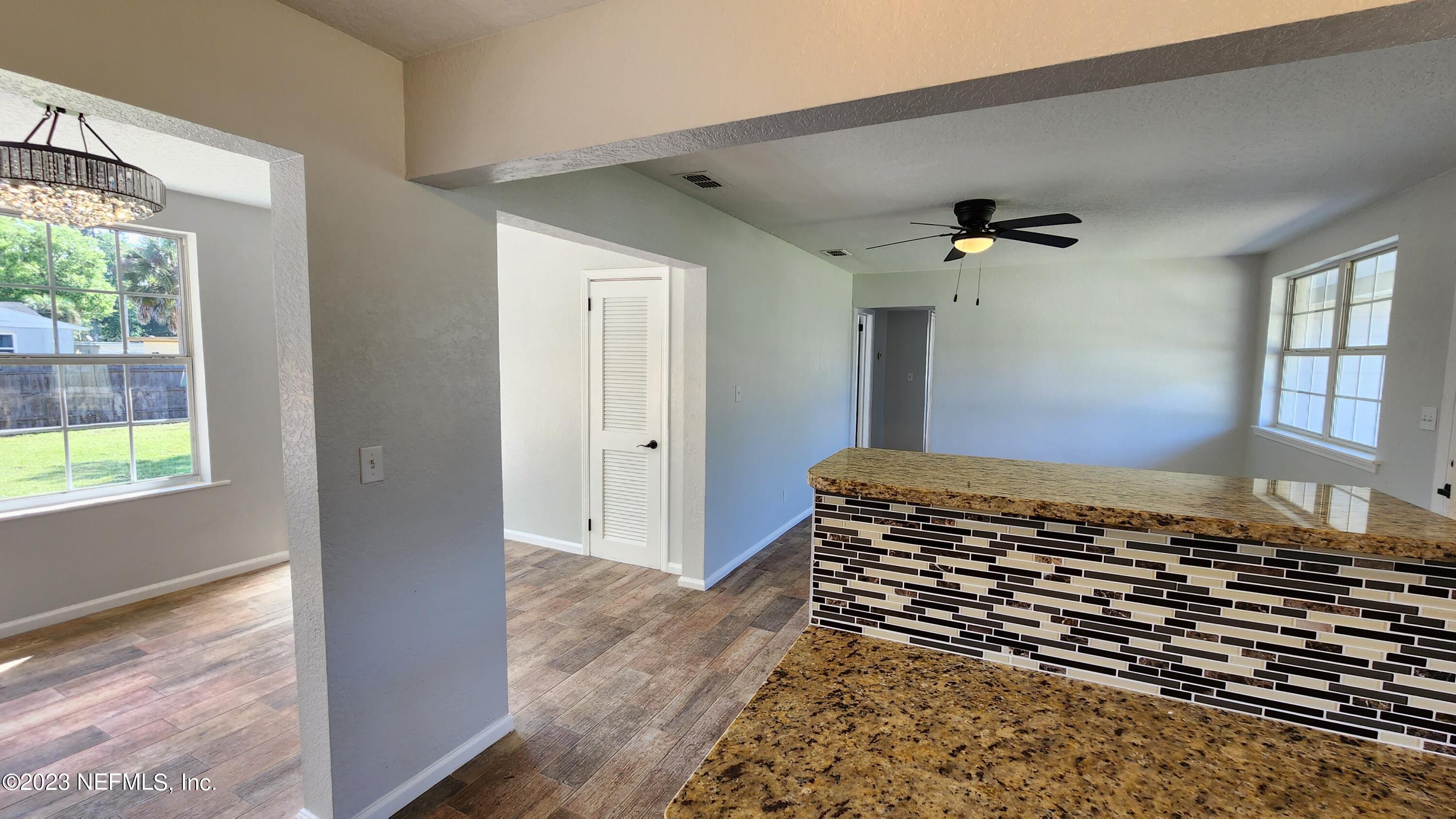 845 Ibis Road Jacksonville, FL 32216 - Photo 12 of 40 Breakfast Bar to Living and Bonus/Dining