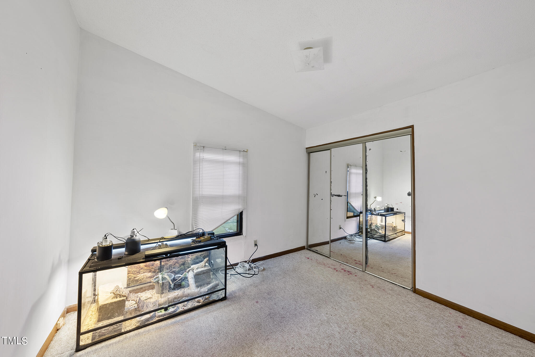 9402 Hampton Road Rougemont, NC 27572 - Photo 13 of 48 a living room with a bed furniture and a window