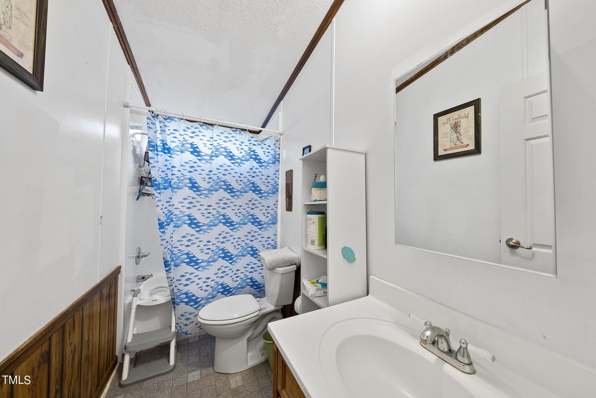 9402 Hampton Road Rougemont, NC 27572 - Photo 14 of 48 a bathroom with a granite countertop toilet a sink and a shower