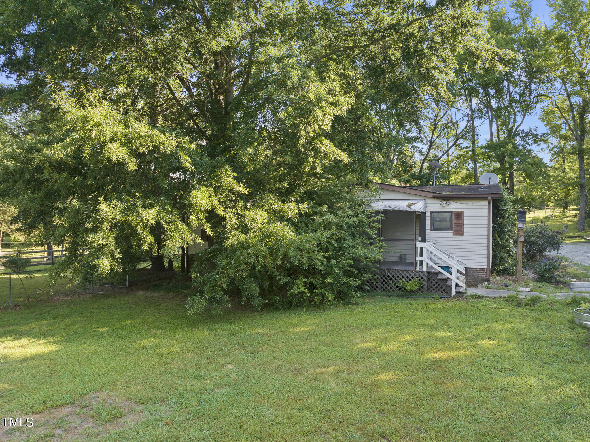 9402 Hampton Road Rougemont, NC 27572 - Photo 20 of 48 a view of a house with backyard and garden