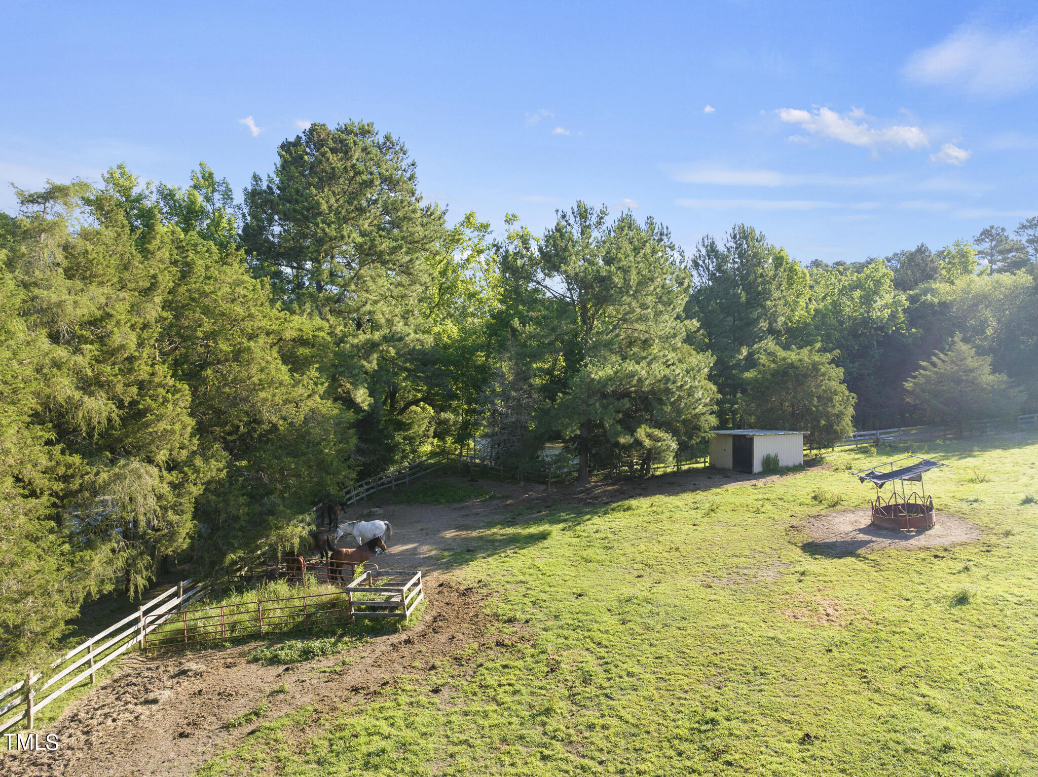 9402 Hampton Road Rougemont, NC 27572 - Photo 21 of 48 a backyard of a house with a yard and outdoor seating