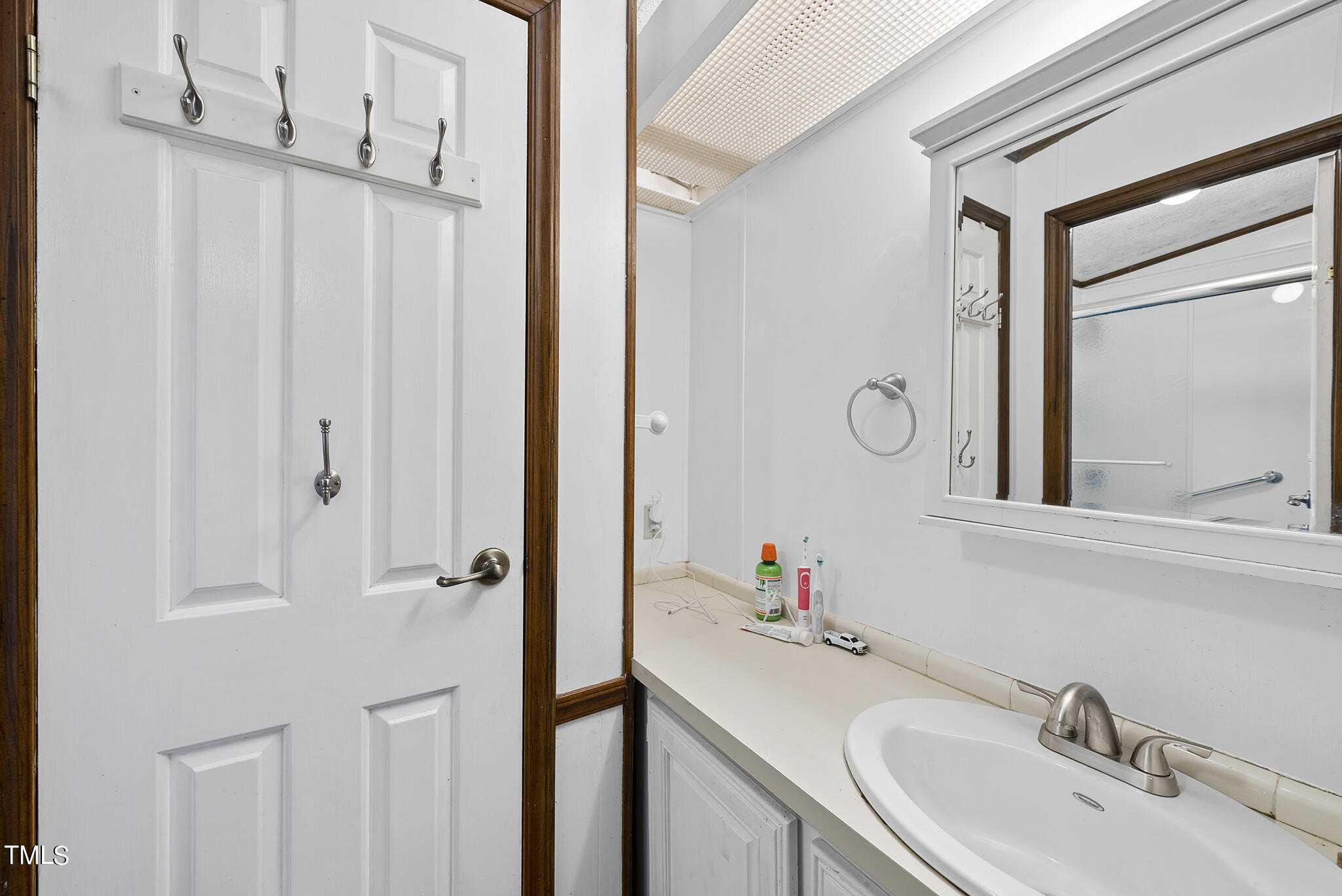 9402 Hampton Road Rougemont, NC 27572 - Photo 10 of 48 a bathroom with a sink and a mirror