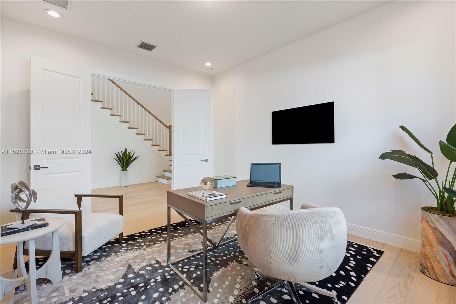 9345 Crestview Circle Palm Beach Gardens, FL 33412 - Photo 11 of 28 a living room with furniture and a flat screen tv