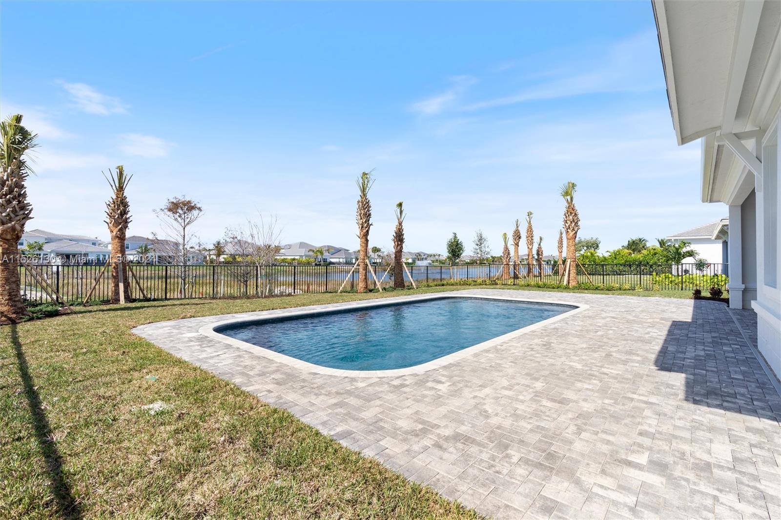 9345 Crestview Circle Palm Beach Gardens, FL 33412 - Photo 15 of 28 a view of a swimming pool