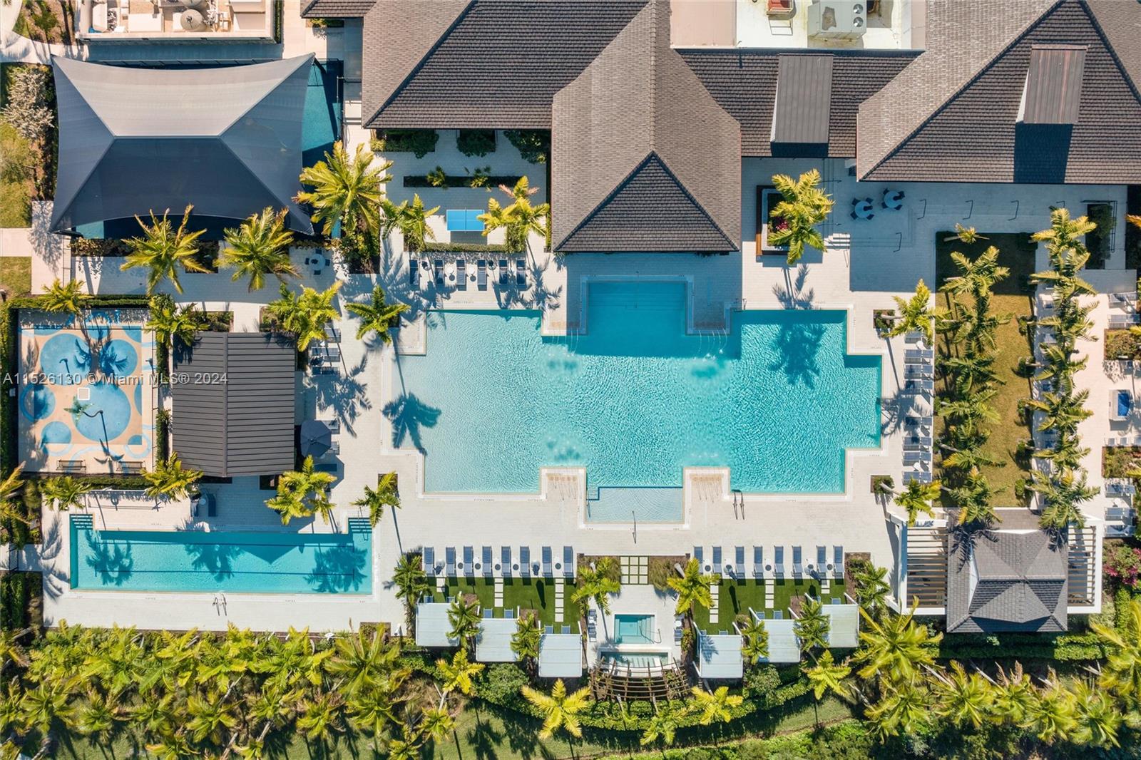 9345 Crestview Circle Palm Beach Gardens, FL 33412 - Photo 20 of 28 a front view of a house with a yard
