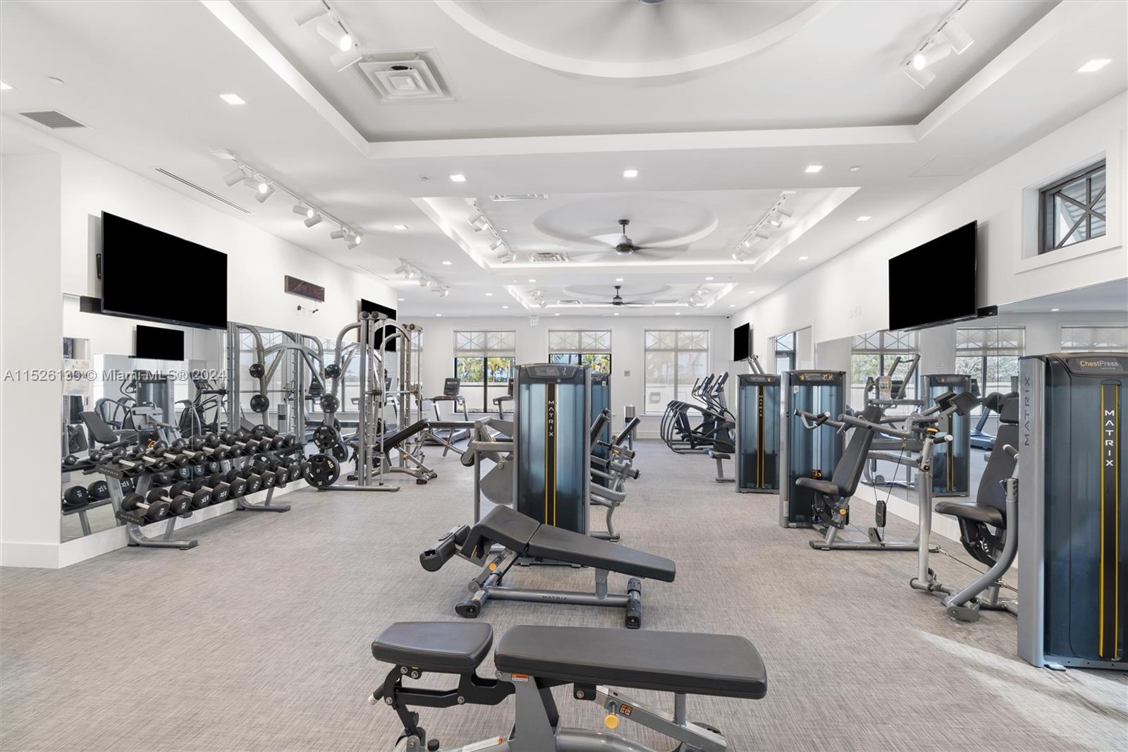 9345 Crestview Circle Palm Beach Gardens, FL 33412 - Photo 21 of 28 a view of a room with gym equipment