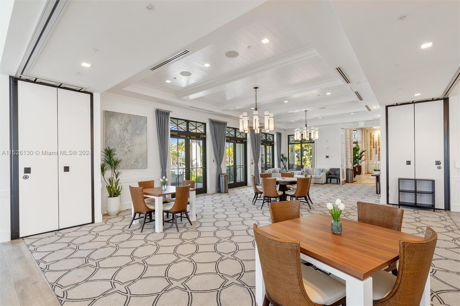 9345 Crestview Circle Palm Beach Gardens, FL 33412 - Photo 22 of 28 a dining room with furniture a chandelier and window