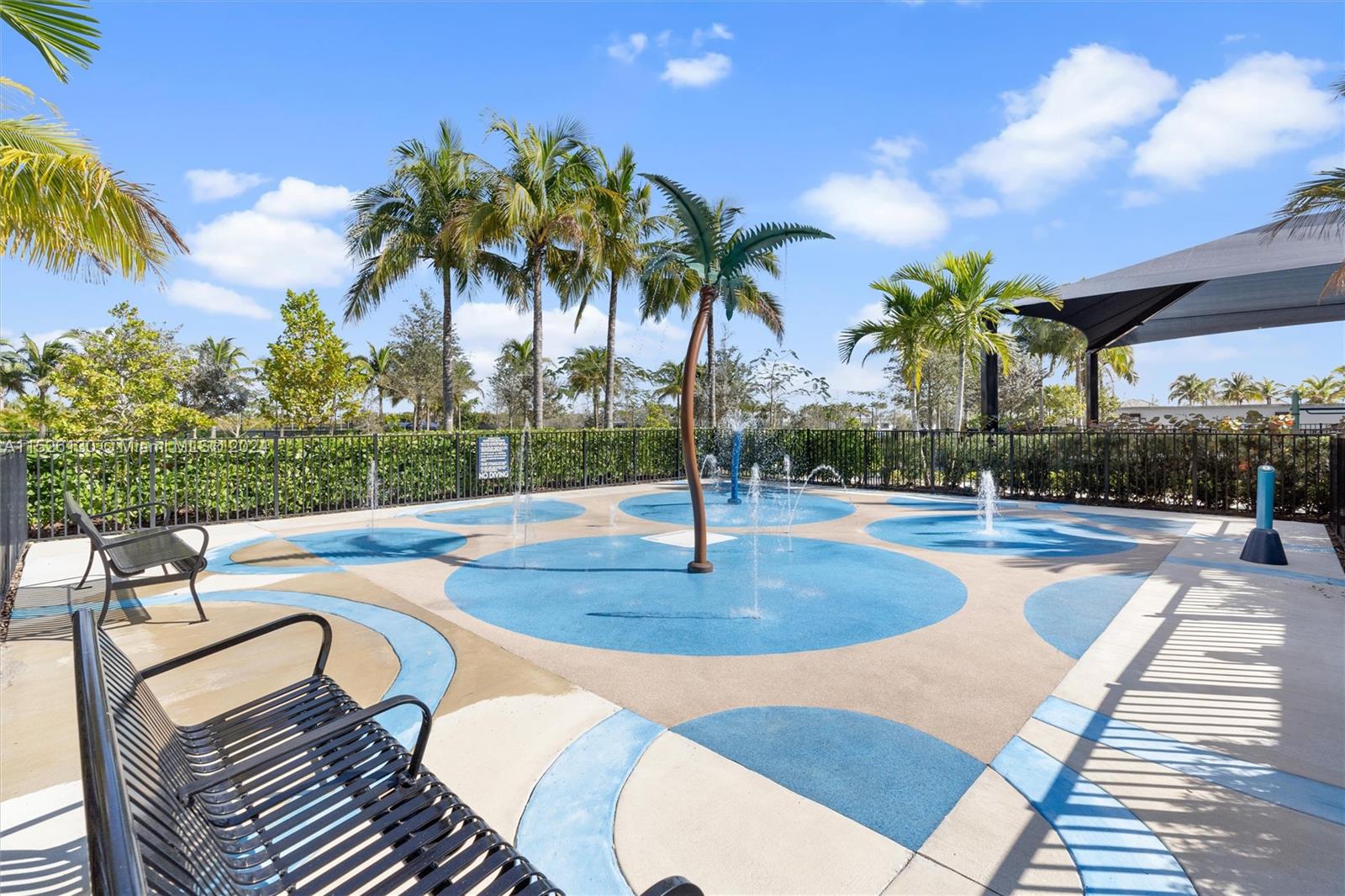 9345 Crestview Circle Palm Beach Gardens, FL 33412 - Photo 23 of 28 a view of a swimming pool with a patio