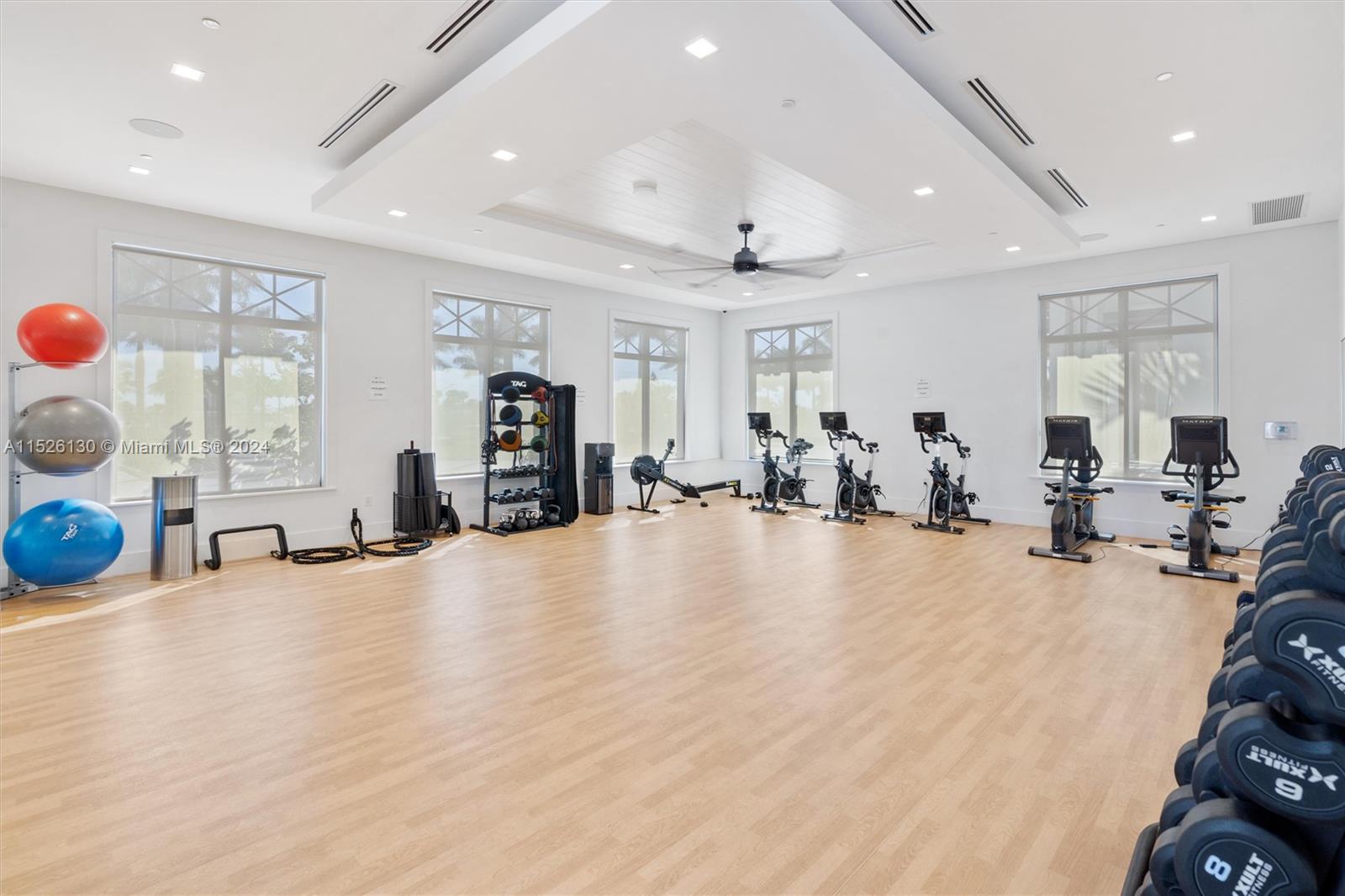 9345 Crestview Circle Palm Beach Gardens, FL 33412 - Photo 26 of 28 a view of a room with gym equipment and window