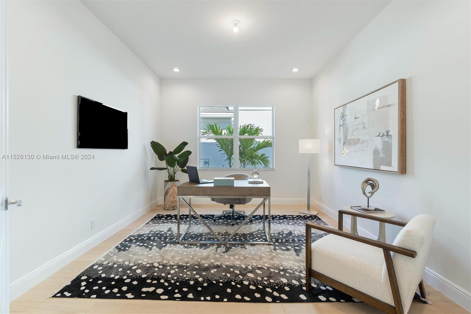 9345 Crestview Circle Palm Beach Gardens, FL 33412 - Photo 9 of 28 a living room with furniture and a flat screen tv