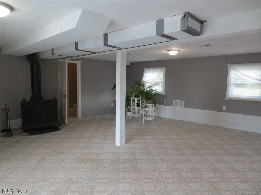 3006 Selkirk Bush Road Warren, OH 44481 - Photo 11 of 21 Another view of the family room showing the woodburner