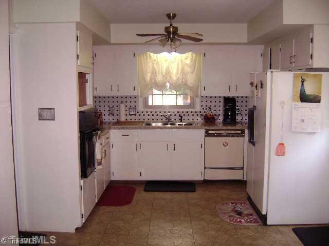 1620 Bright Leaf Road Pfafftown, NC 27040 - Photo 5 of 16 Exterior Front. Kitchen with tile backsplash.