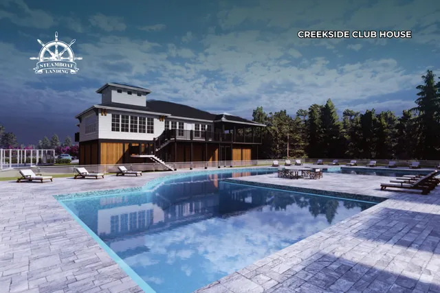 an aerial view of a house with pool patio and outdoor seating