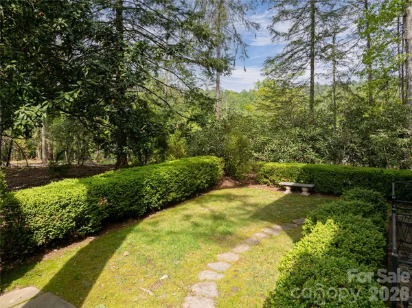 a view of swimming pool from a garden