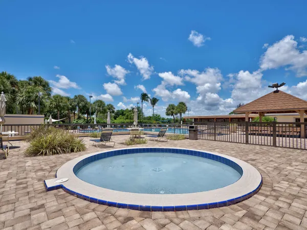 a view of a house with swimming pool and a yard
