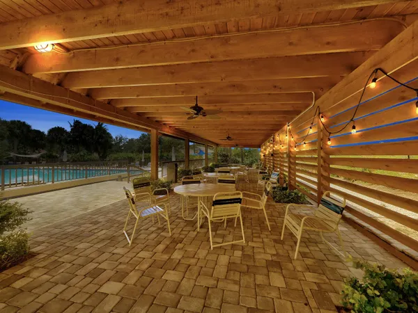 a patio with table and chairs