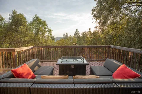 a view of a house with a mountain in the background