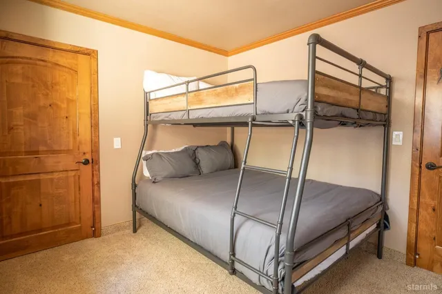 a livingroom with workspace and a couch