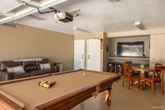 a living room with furniture and a table