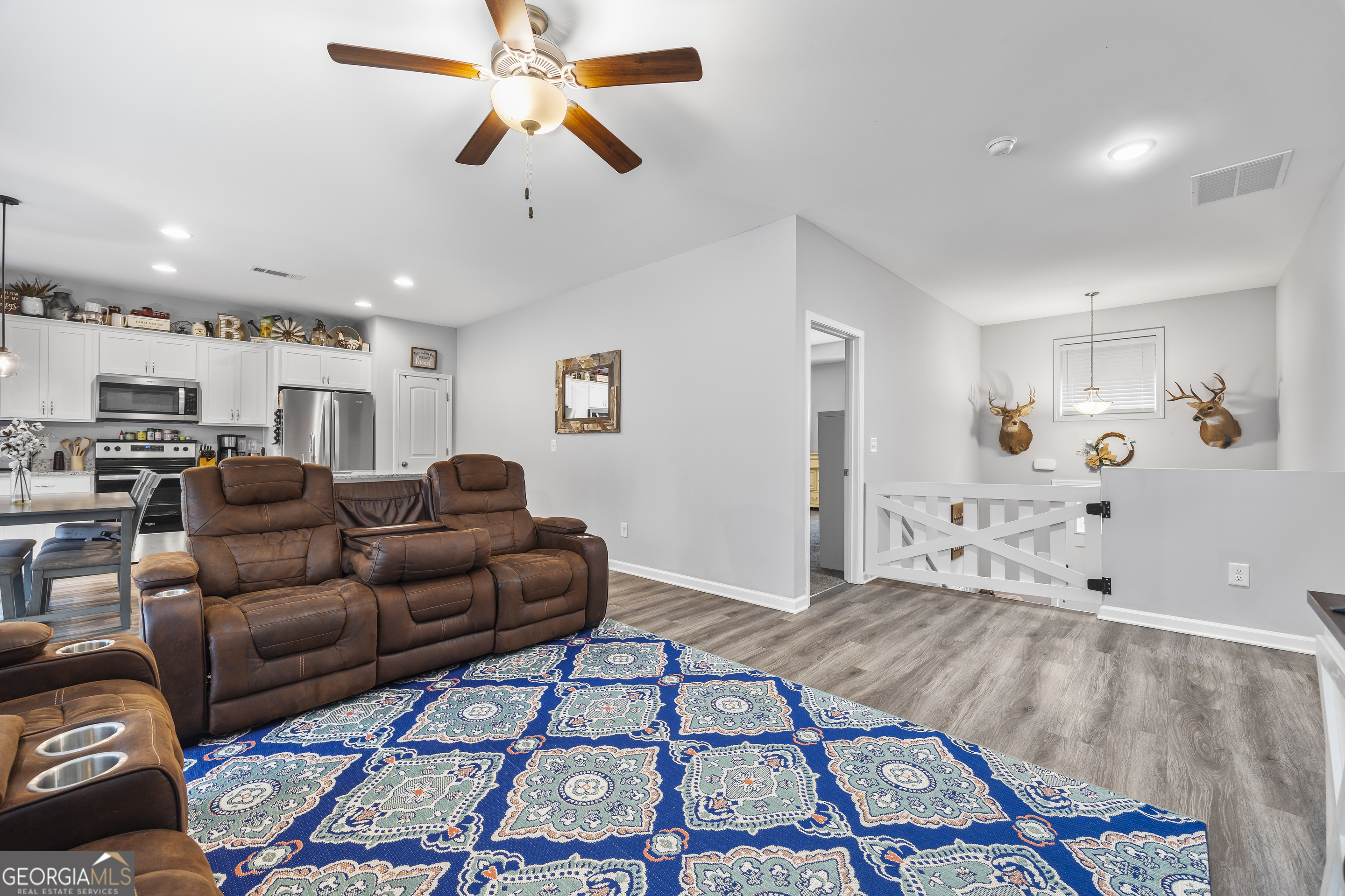 1350 Noah Crow Road Royston, GA 30662 - Photo 17 of 48 a living room with furniture and a chandelier