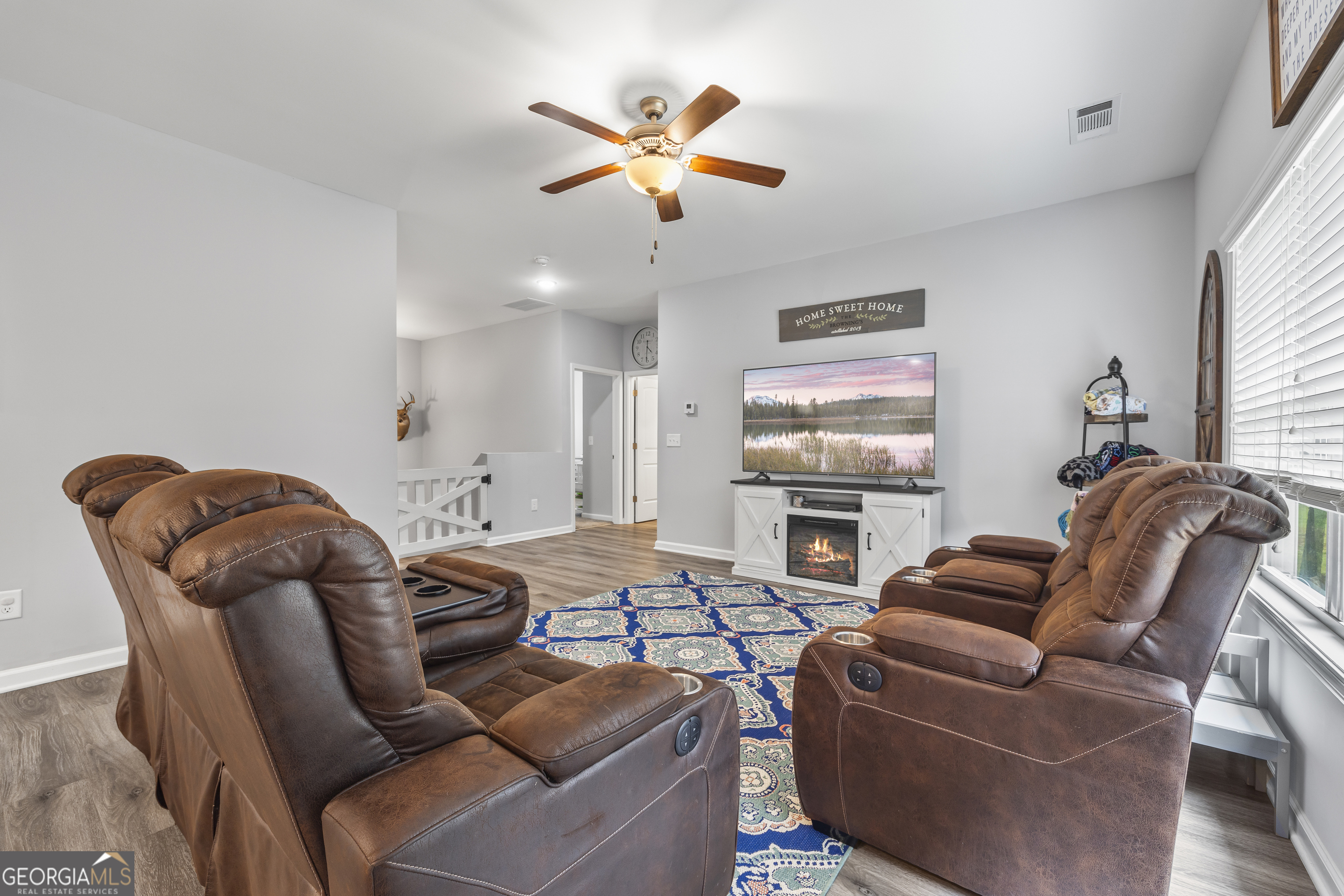 1350 Noah Crow Road Royston, GA 30662 - Photo 19 of 48 a living room with furniture a ceiling fan and a window