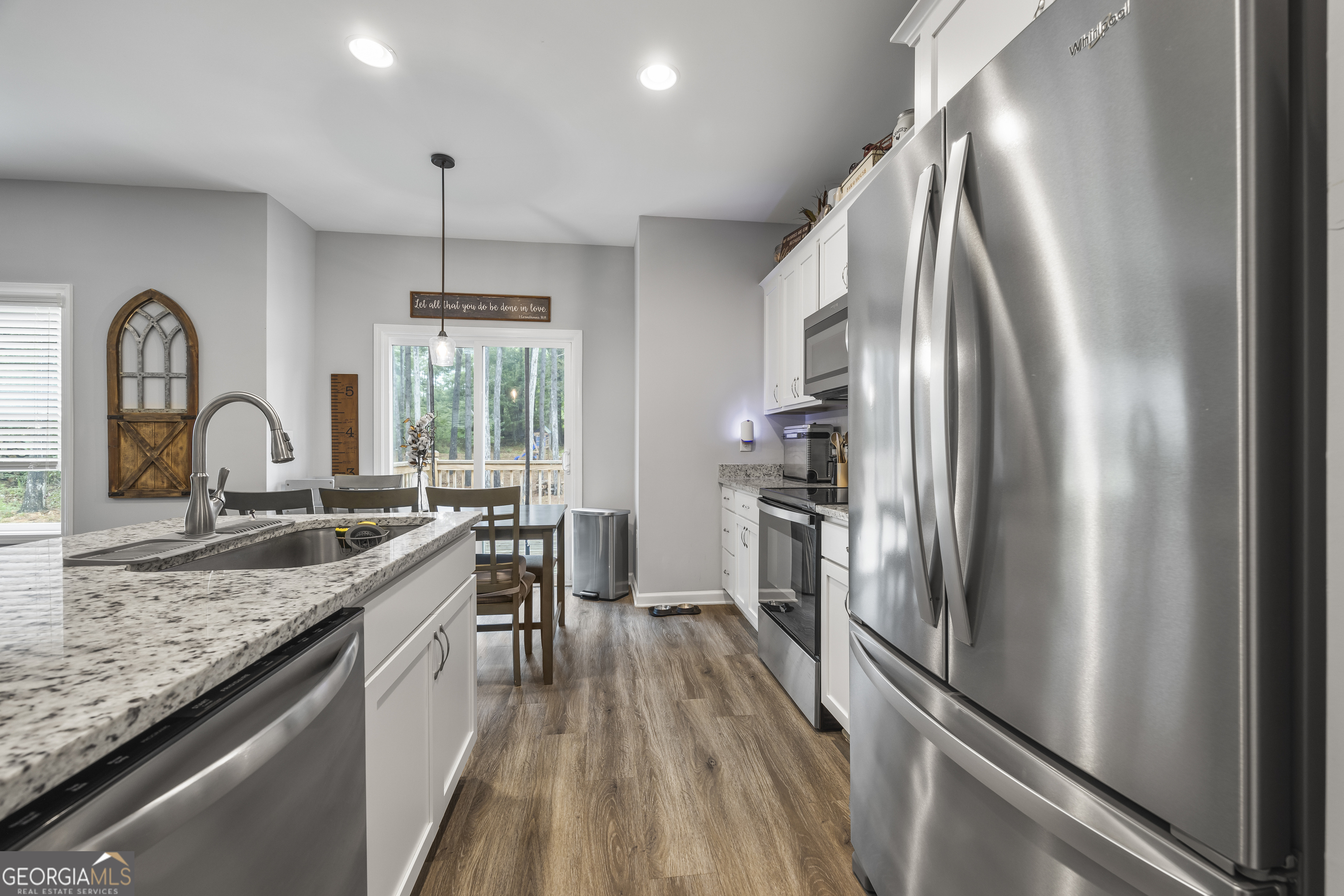 1350 Noah Crow Road Royston, GA 30662 - Photo 22 of 48 a kitchen with stainless steel appliances granite countertop a sink stove and refrigerator