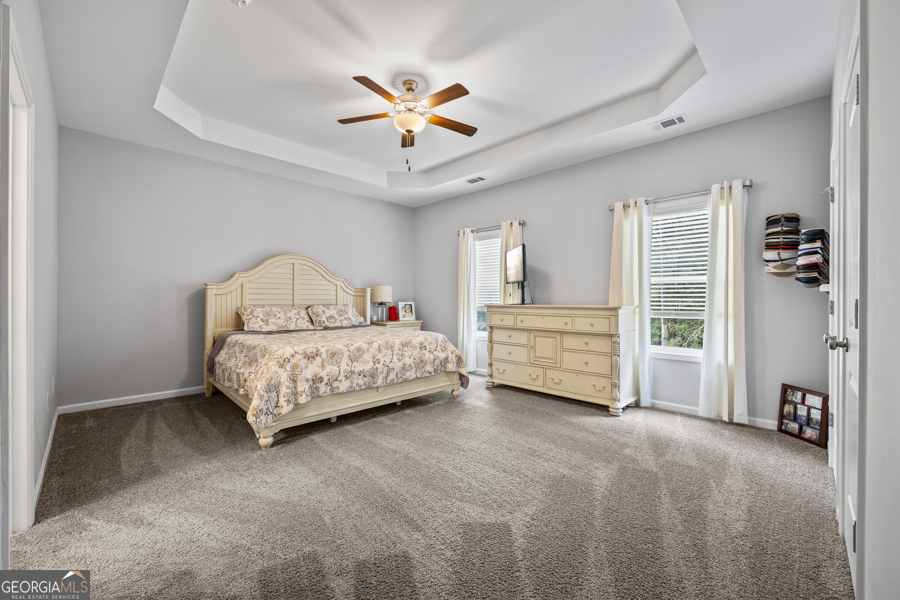 1350 Noah Crow Road Royston, GA 30662 - Photo 27 of 48 a bedroom with a bed and a ceiling fan