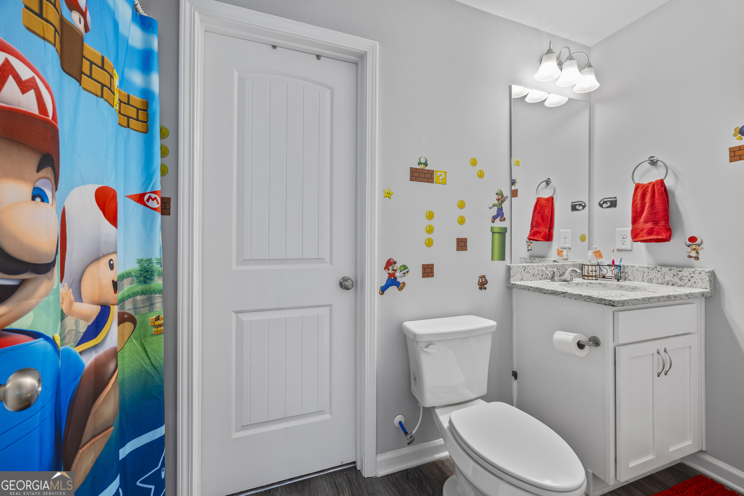 1350 Noah Crow Road Royston, GA 30662 - Photo 45 of 48 a bathroom with a sink vanity mirror and toilet