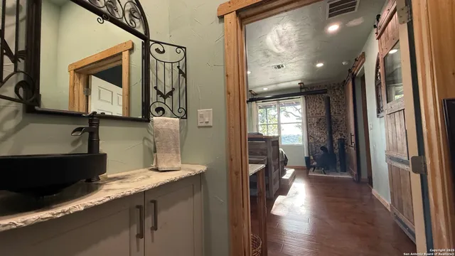 a living room with furniture and large windows