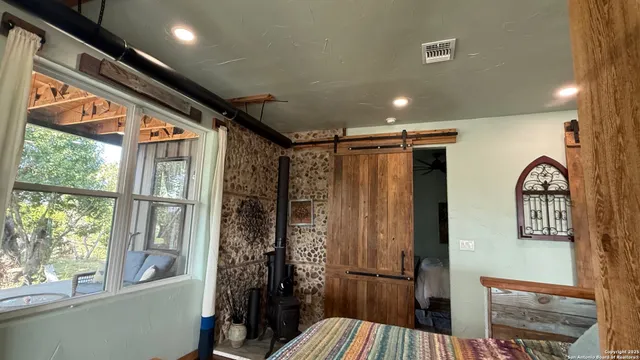 a kitchen with a sink appliances and cabinets