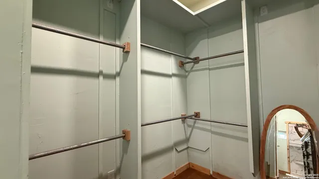 a room with a bed and a television