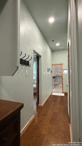 a kitchen with a refrigerator and a sink