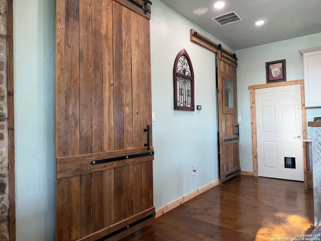 a kitchen with a refrigerator and a sink