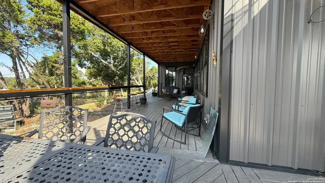 a bedroom with a bed and a flat tv screen