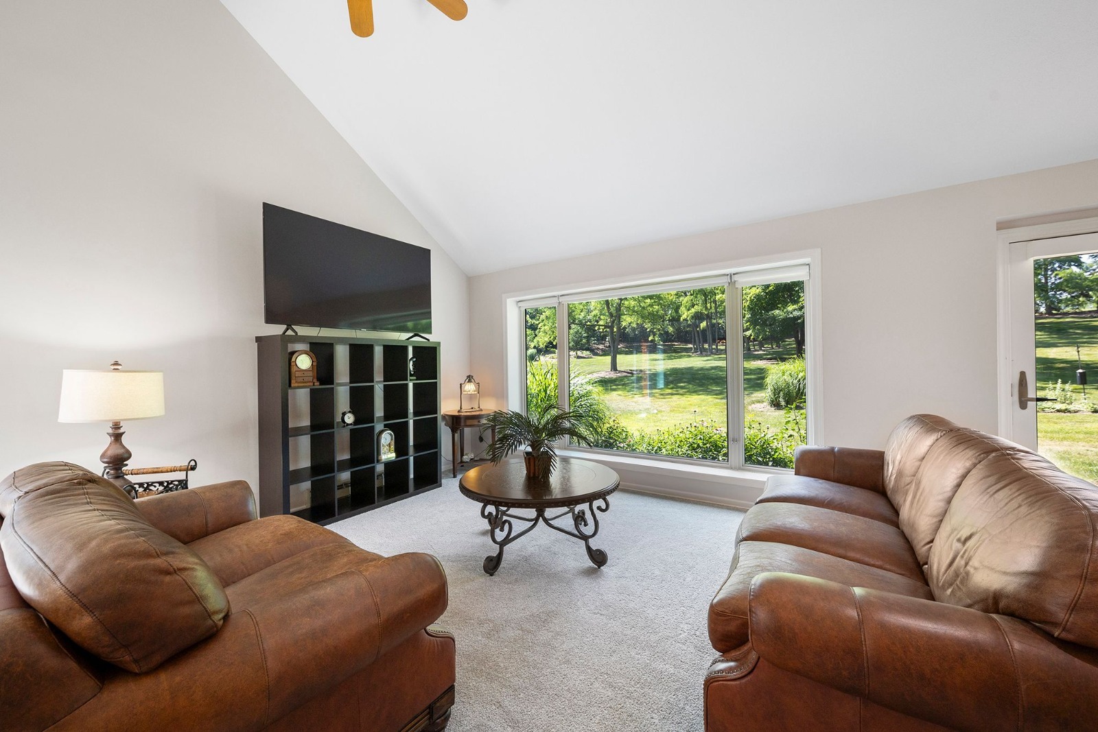 37W271 Weld Road Elgin, IL 60124 - Photo 11 of 24 a living room with furniture a flat screen tv and a large window
