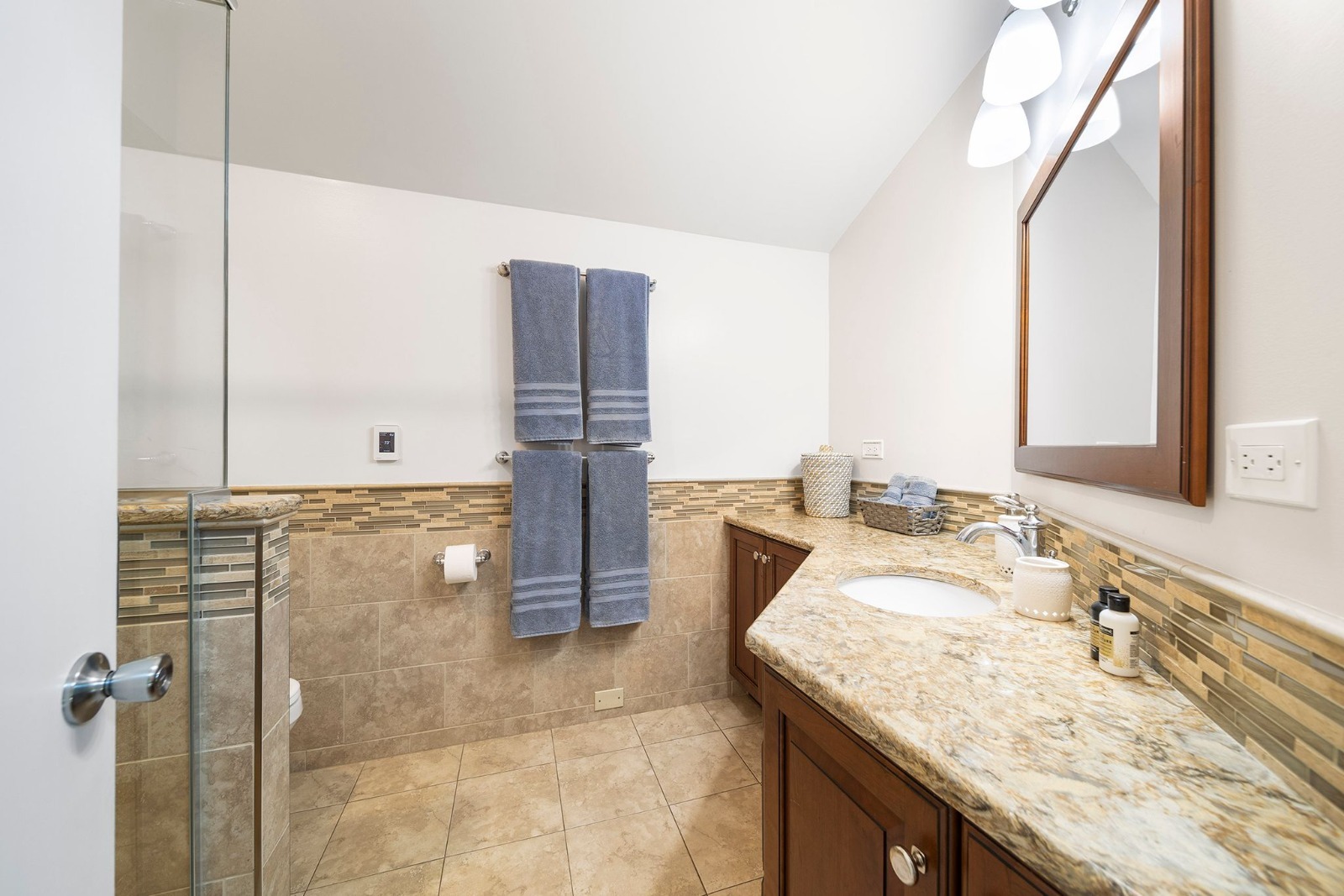 37W271 Weld Road Elgin, IL 60124 - Photo 14 of 24 a bathroom with a granite countertop sink a mirror and shower