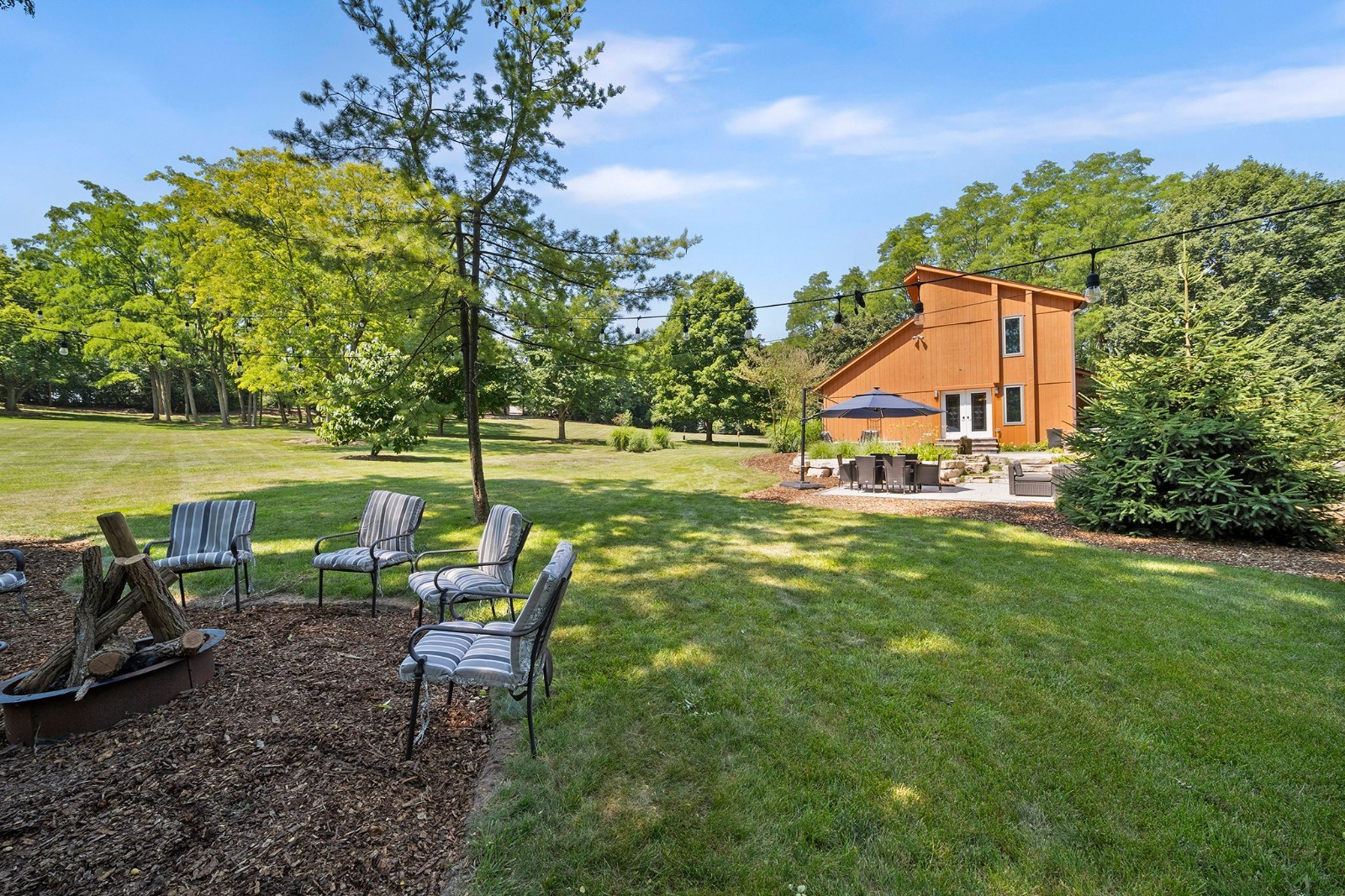 37W271 Weld Road Elgin, IL 60124 - Photo 3 of 24 a view of a house with a yard and sitting area