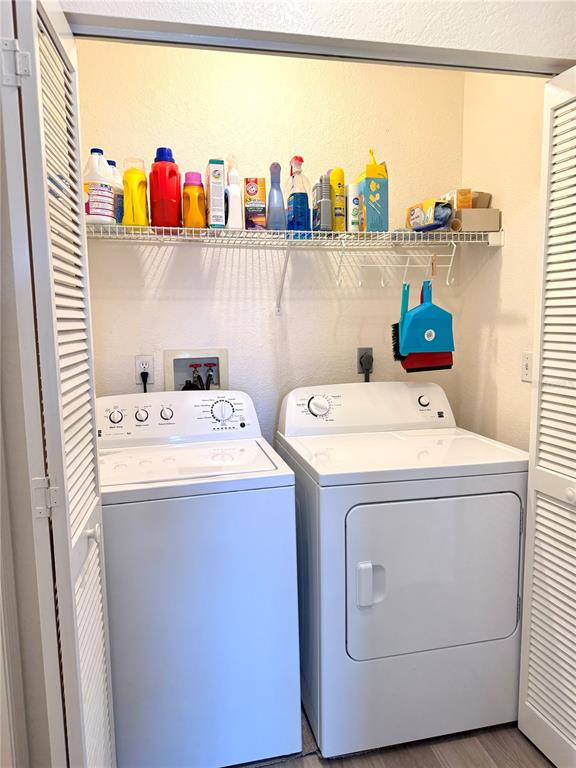 26267 Northern Cross Road, Unit 1A Punta Gorda, FL 33983 - Photo 13 of 34 a utility room with dryer and washer